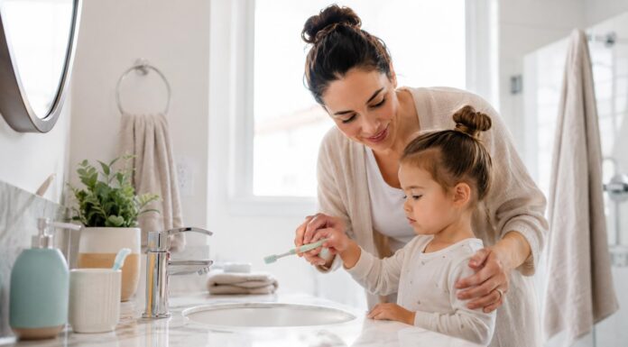 Children’s Dental Health: Essential Tips for Parents Parent helping young child brush teeth to maintain good dental health